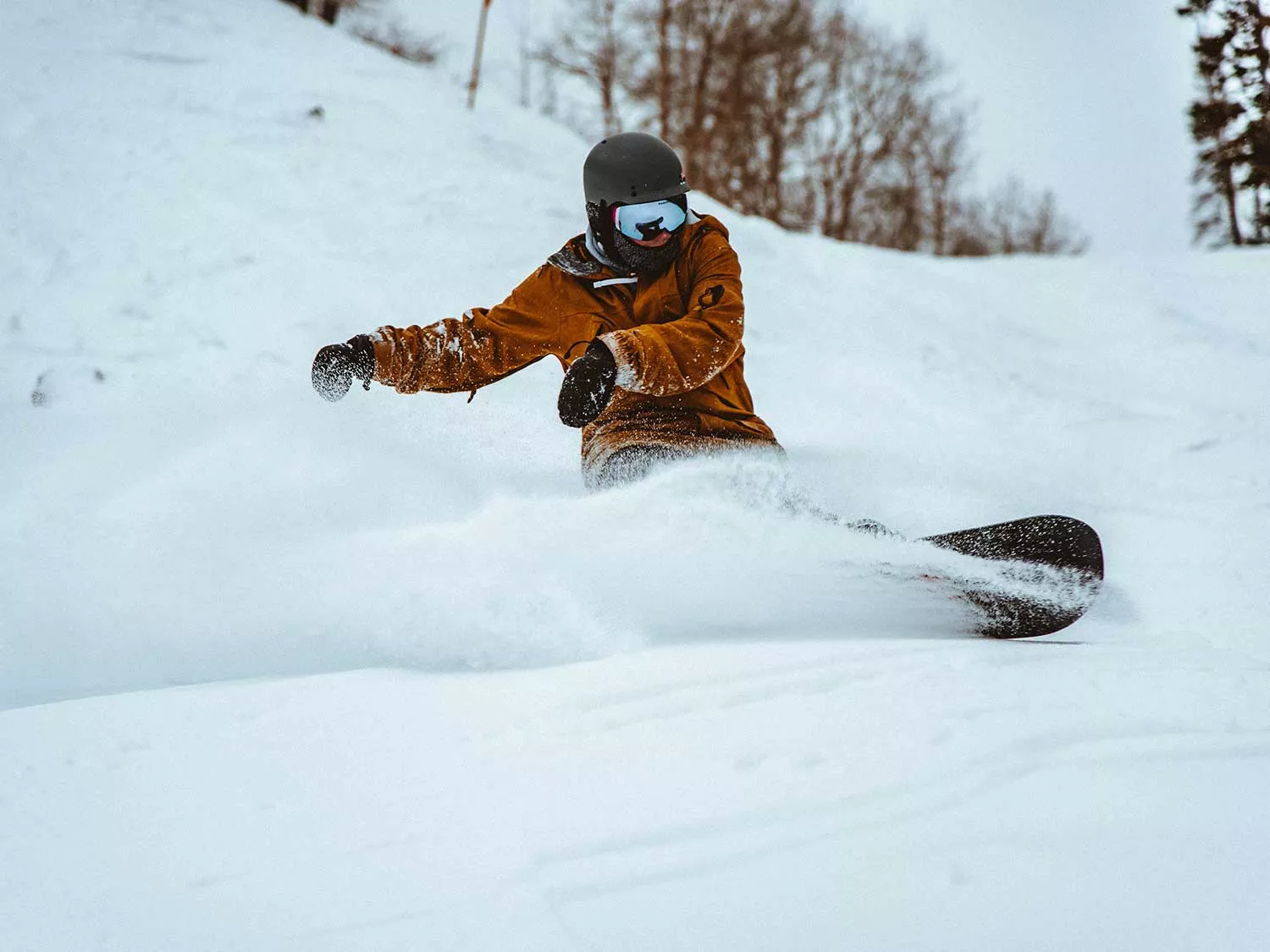 Snowboarding down a mountain.