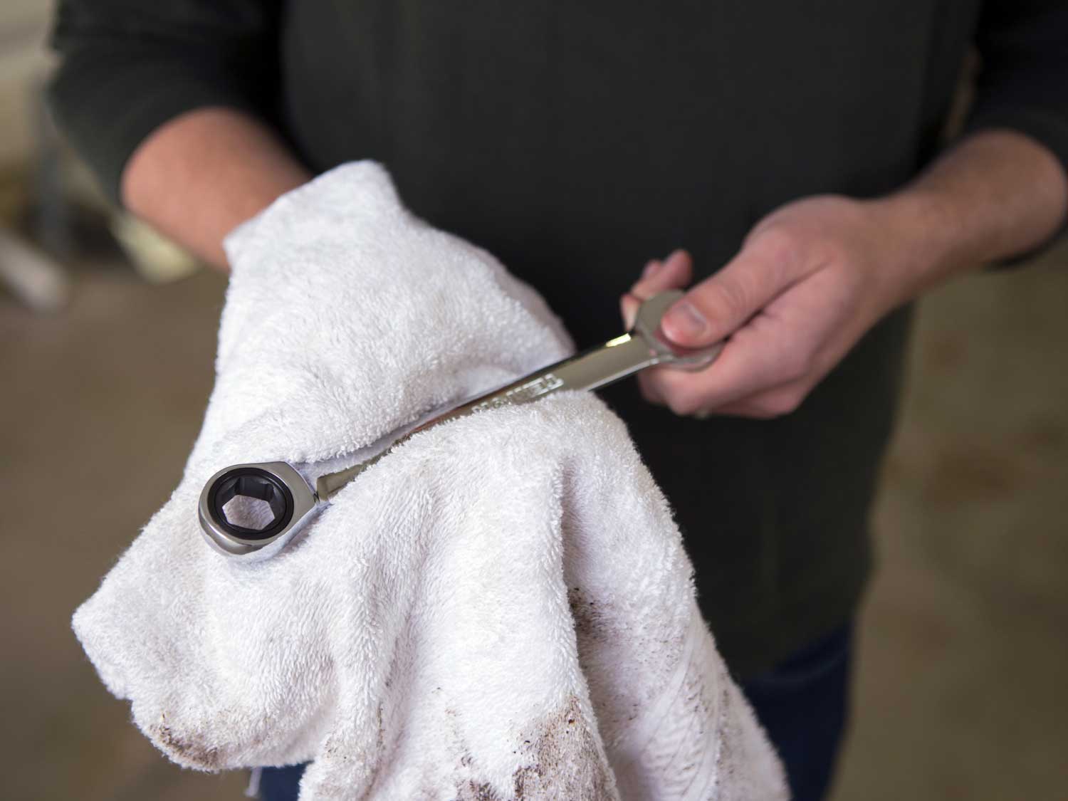 Cleaning wrench with towel.