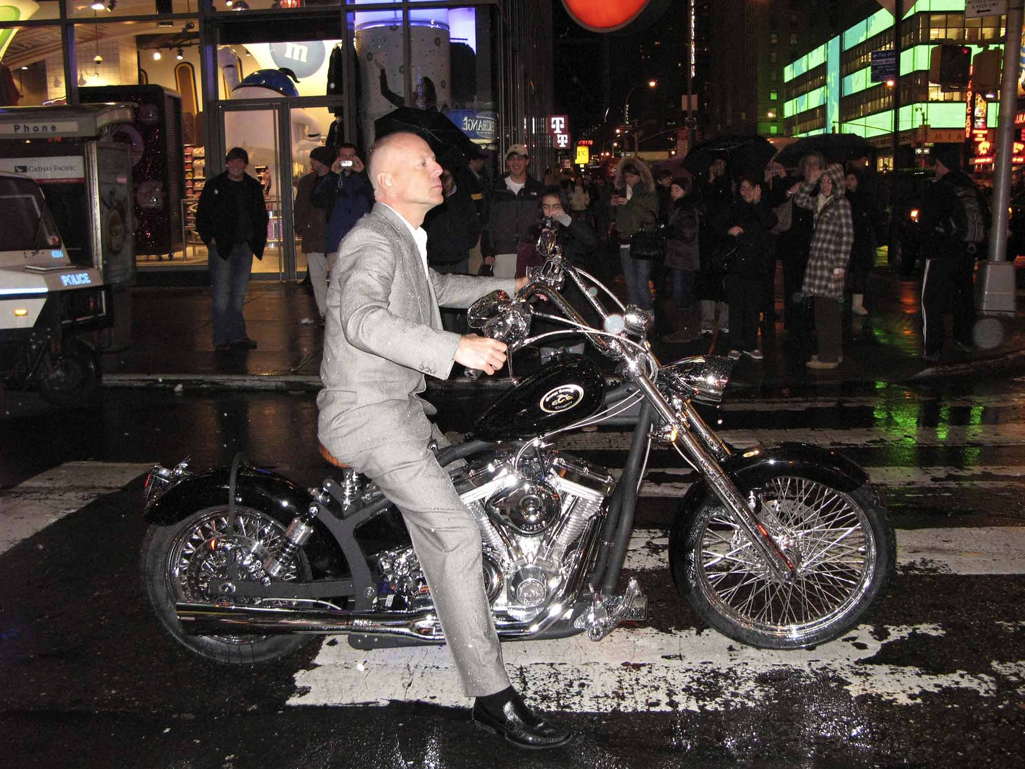Dressed to the nines in New York, Bruce Willis straddles a custom Orange County Chopper down the streets. 