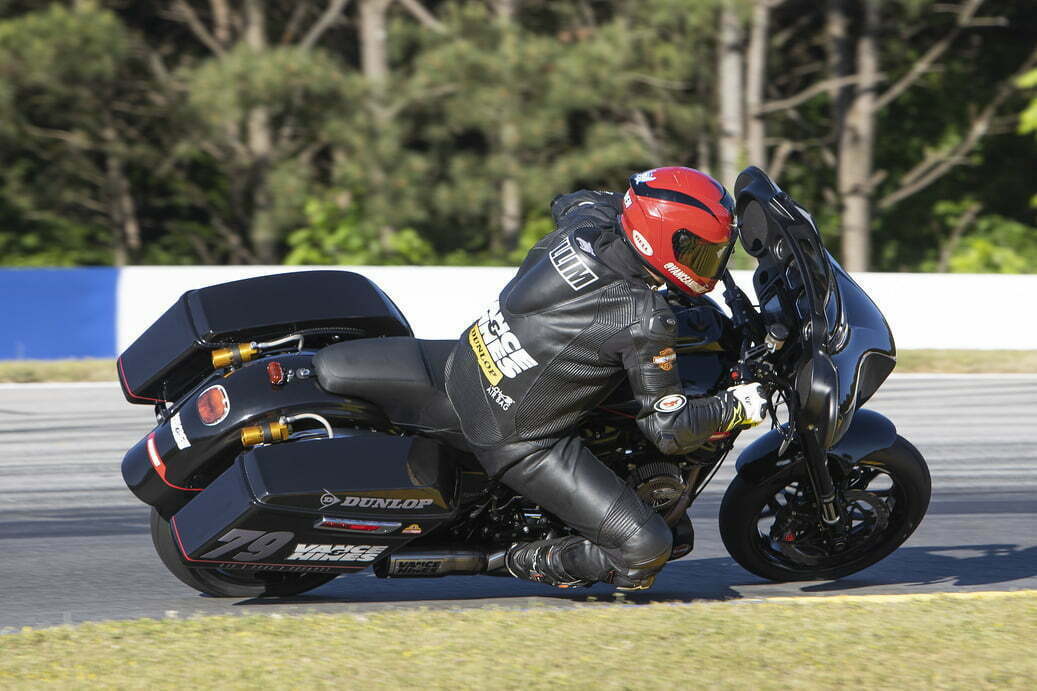 A motorcycle racer competes in the 2021 King of the Baggers race series.